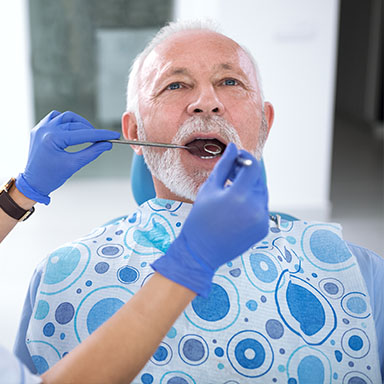 Older man receiving dental care