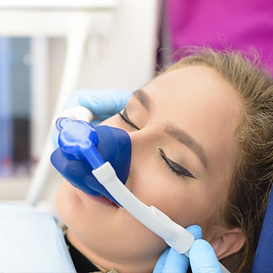 Woman with nitrous oxide nasal mask