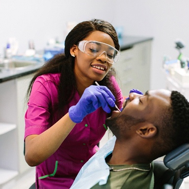 patient getting their teeth cleaned