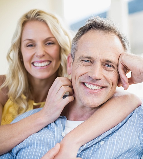 Older man and woman smiling together