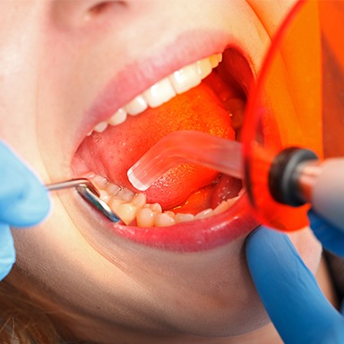 Patient receiving dental bonding treatment