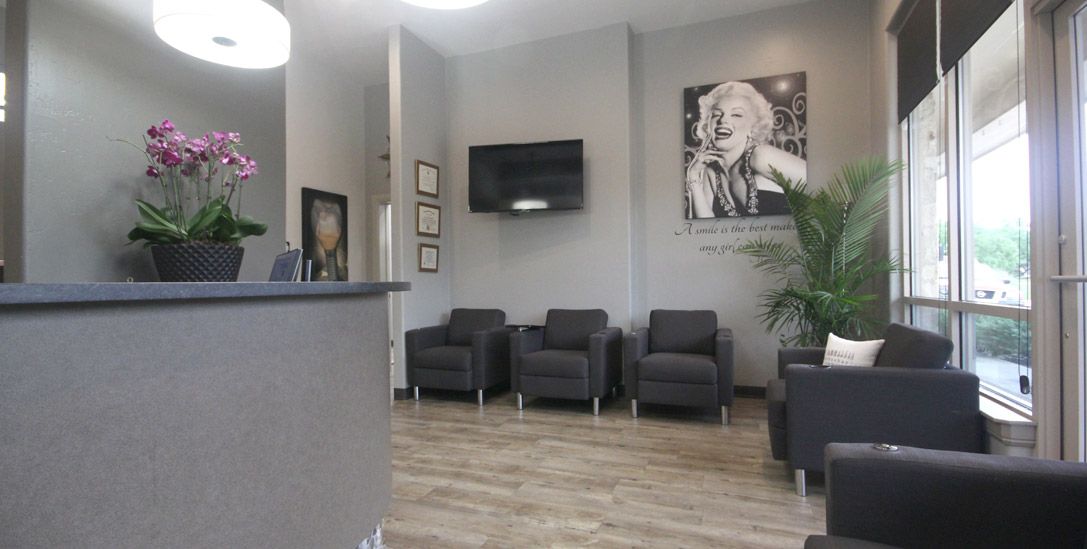 Smiling team member at reception desk