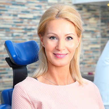 Smiling woman in dental chair