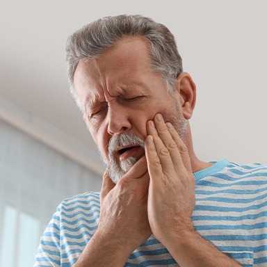 Man holding jaw