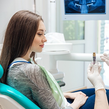 Dentist talking to patient about dental implants