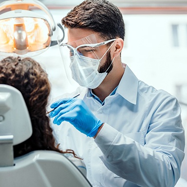 Dentist conducting dental procedure