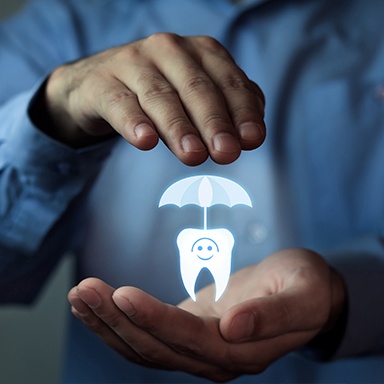 Hands holding an animated tooth with umbrella