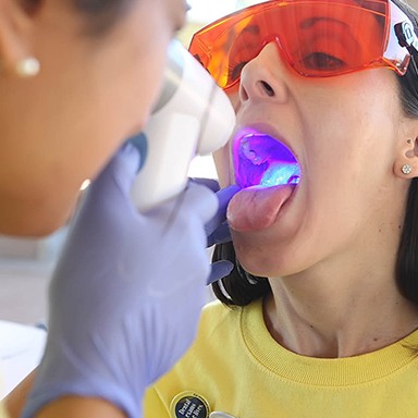 Patient receiving oral cancer screening