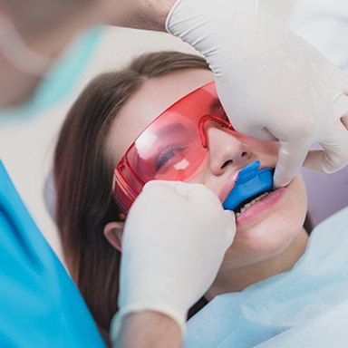 Woman receiving fluoride treatment