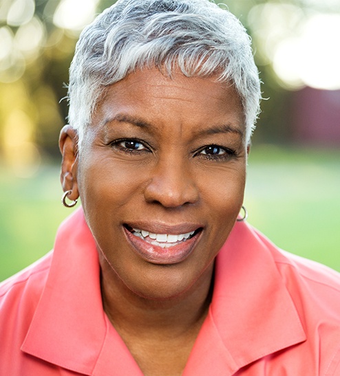 Smiling older woman outdoors