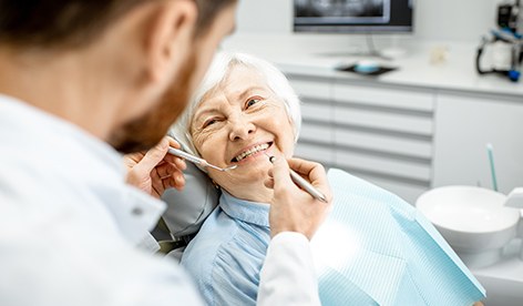 Older woman receiving dental treatment