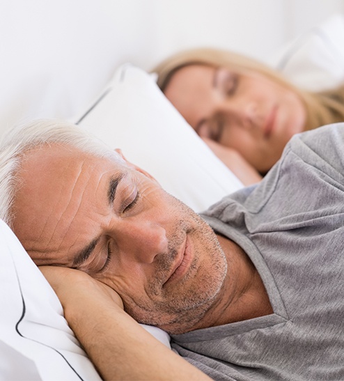 Man and woman sleeping soundly together