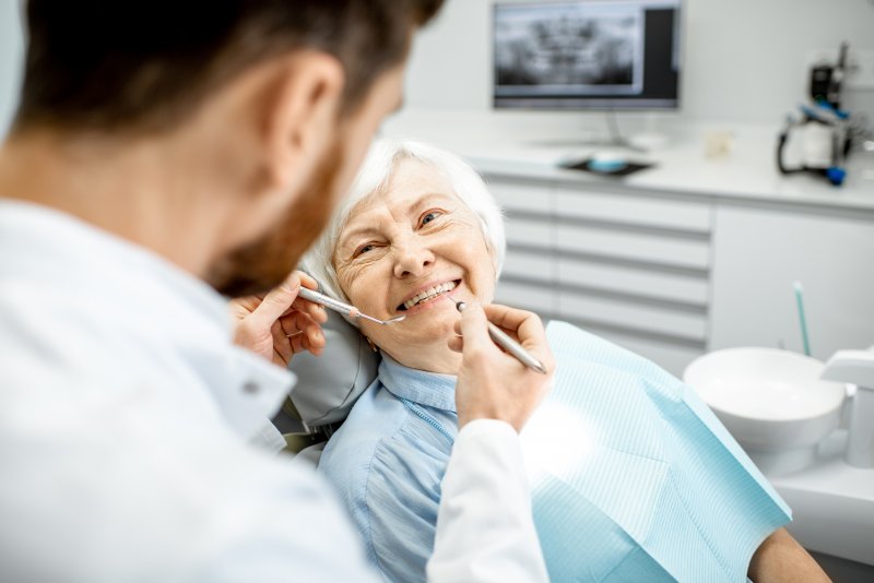 Woman smiling during dentist appointment